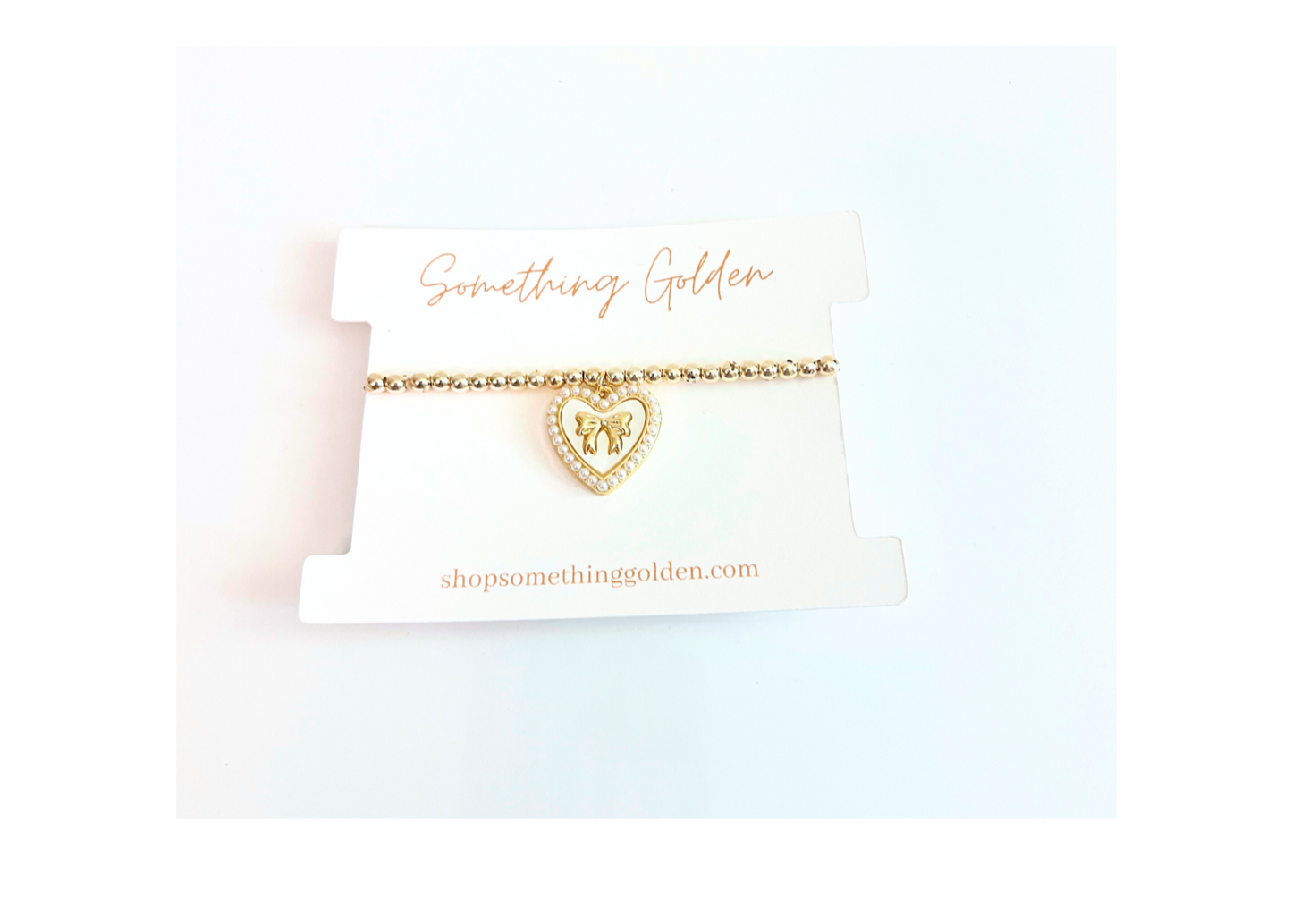 The Heart & Bow Charm